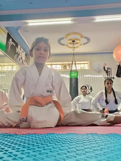 Flexibility training is a crucial part of our curriculum, helping to prevent injuries and improve kicking techniques.