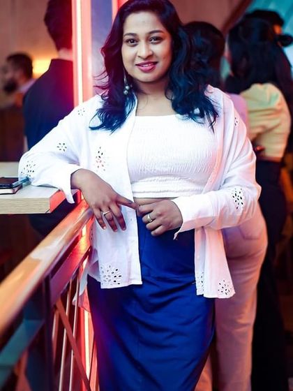 A friendly pose from a partygoer enjoying the atmosphere.