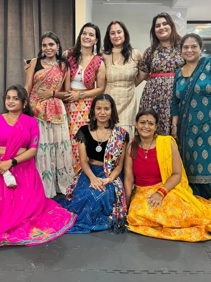 A beautiful group photo from our Navratri celebration. Everyone dressed in their festive best.