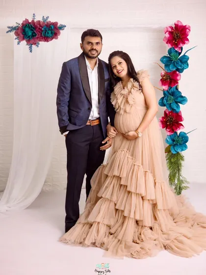A picture of pure happiness. This couple looks so radiant and excited for their new arrival in this beautifully styled studio shot.
