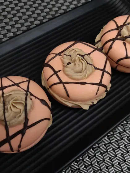 This is a cold process donut soap, made with nourishing oils like olive and coconut oil. The whipped soap topping and chocolate drizzle make it look like a decadent coffee-flavored treat.