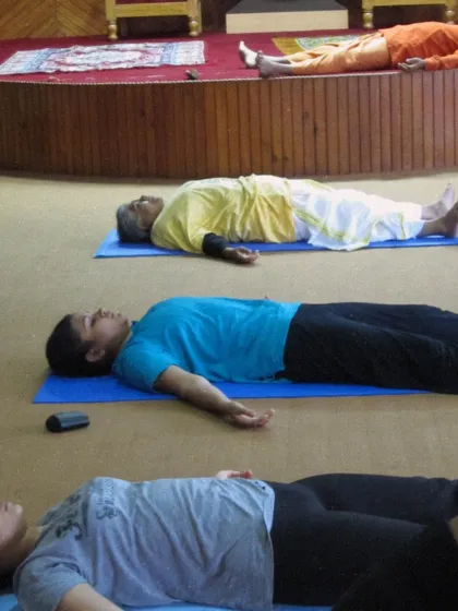 Students resting in Savasana during a Teachers' Training Course. Learning to teach this pose effectively is as important as learning to practice it.