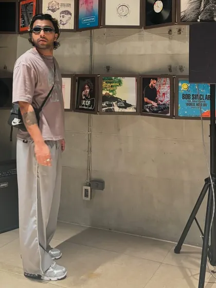 A candid shot in a room filled with vinyl records. This is my happy place, surrounded by music history.
