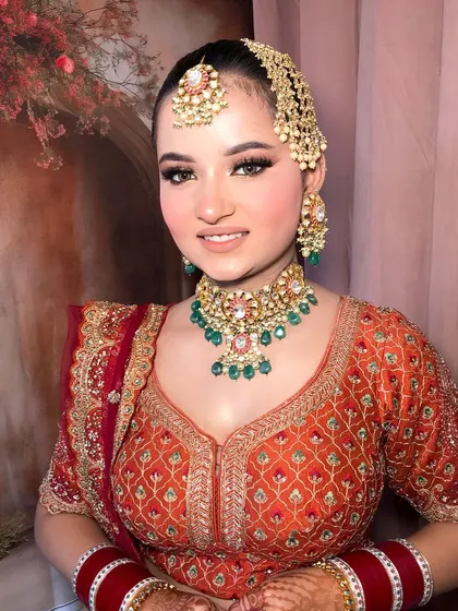 A happy, smiling bride, her joy infectious. The jewelry adds to her radiant glow.