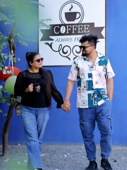 A sweet and simple pre-wedding photo at a coffee-themed backdrop. It’s a great example of how we can use the environment to tell a little story about the couple's interests.