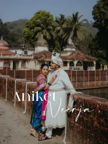 A romantic portrait of the couple at their destination wedding in Goa, set against the backdrop of a traditional temple.