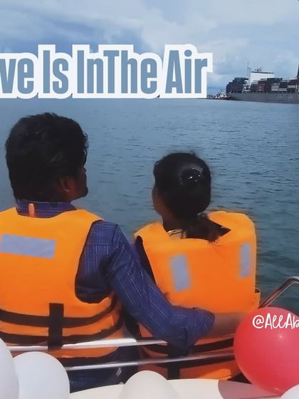 Love is in the air, and on the sea! A couple enjoying the view from the back of the yacht.