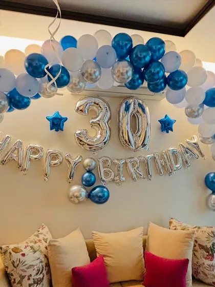 The complete 30th birthday living room setup, ready for the party.