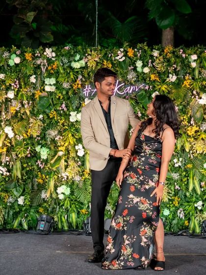 A romantic moment in front of a beautiful floral backdrop. The right choreography complements the decor and theme of your sangeet.