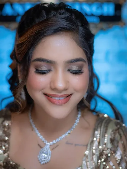 A smiling close-up that shows how a well-executed glam look can still appear soft and beautiful.