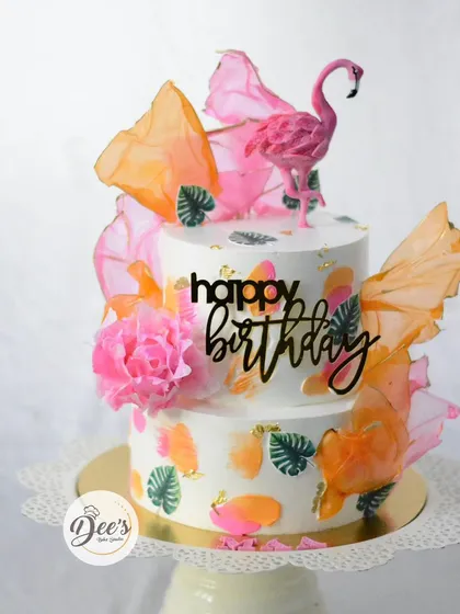 This tropical-themed cake brings the party vibes with its vibrant colors and chic design. I used modern techniques like wafer paper sails and hand-painted details, topped with a sculpted flamingo, to create a cake that's perfect for a stylish birthday celebration.