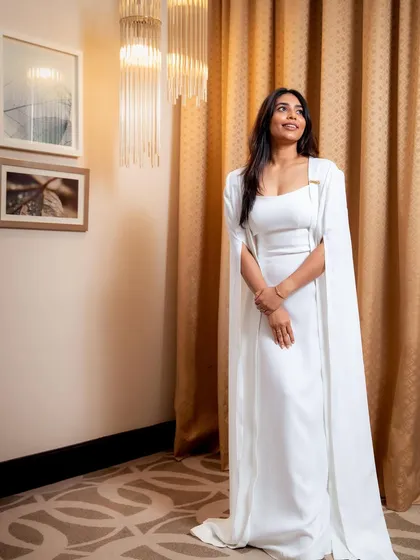 It was an honor to design this elegant white cape gown for the lovely Sapthami Gowda. We wanted a look that was powerful and graceful, and this custom creation was perfect for her award-winning moment on the red carpet.