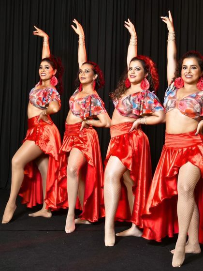 A synchronized pose showing the clean lines and elegant posture we focus on in our ladies' styling and performance classes.