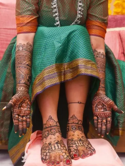 A complete bridal look, showing how the traditional hand and feet mehendi designs complement each other perfectly.