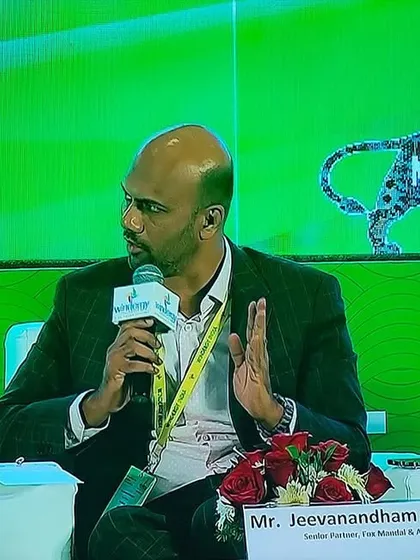 Our Senior Partner, Jeeva Rajagopal, speaks at the Windergy India Conference against the backdrop of the 'Make in India' logo. His discussion centered on financing India's transition to green energy.