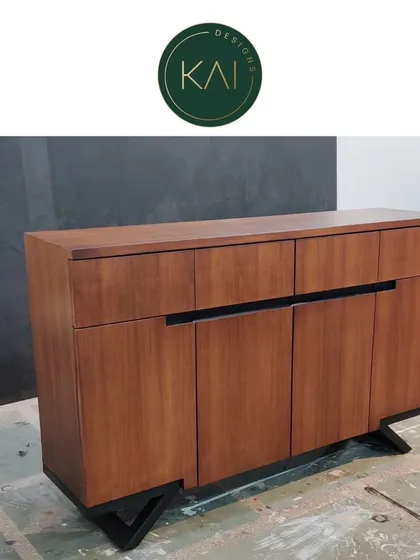 A modern wooden sideboard with clean lines and minimalist hardware. The angled black metal legs add an industrial touch to this otherwise classic piece, making it suitable for a variety of decor styles.