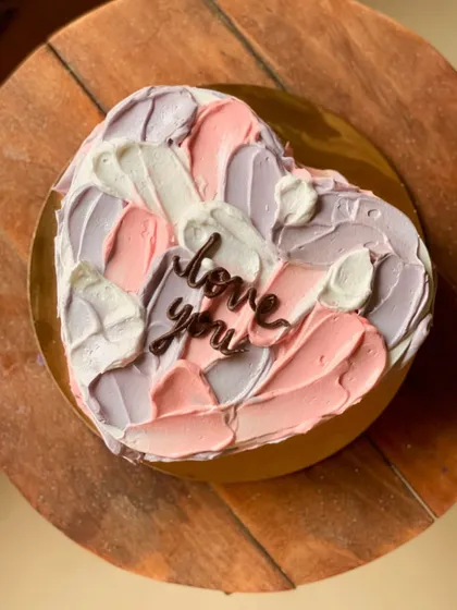 A top-down view of the abstract pastel heart cake, showing the beautiful blend of colors.