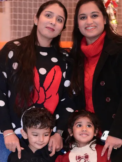 Mothers and their children posing for a photo during our Christmas celebration.