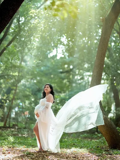 This is what dreams are made of. I love using the golden hour light in nature to create these truly magical portraits. The flowing gown and the sun filtering through the trees make for a timeless memory of this special journey.