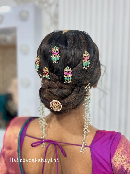 A final look at the royal and elegant bun with traditional jewellery.