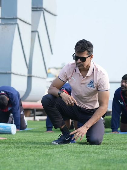 Instructing the team during a pre-game activation. My job is to ensure they are primed for performance.