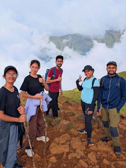 Friends posing together on the rocky trail of Netravathi peak.