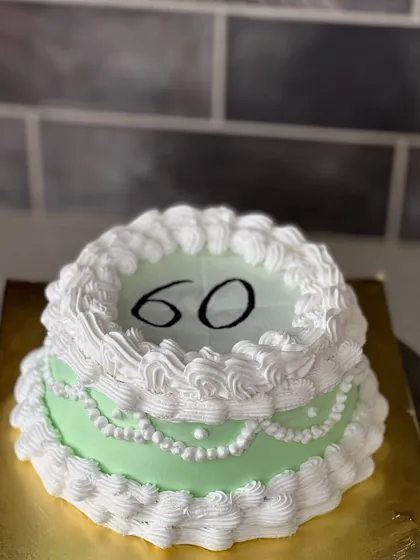 This burn away cake was for a 60th birthday celebration. The top layer shows the number 60, ready to be lit to reveal a surprise underneath.