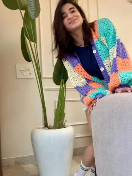 Here’s the modern side of our crochet work. This chunky, color-blocked cardigan shows how we blend traditional craft with today's trends. It’s perfect for pairing with jeans for a casual, stylish look that’s full of personality.