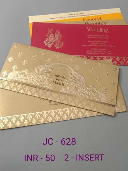 This gold invitation has a classic, elegant design with embossed details. The set includes colorful inserts in red and yellow for a traditional and festive feel.