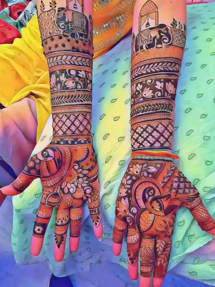 This vibrant bridal mehandi showcases traditional elephant motifs on the forearms. The rich color and bold patterns make it perfect for a grand wedding celebration.