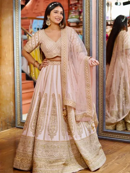 Pastel lehengas are such a vibe for day weddings or your engagement. This soft pink lehenga with detailed golden embroidery is the definition of elegance and grace, giving you a soft, romantic look.