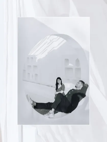 An artistic, playful shot using a large circular window as a frame, showcasing our creative approach to composition.