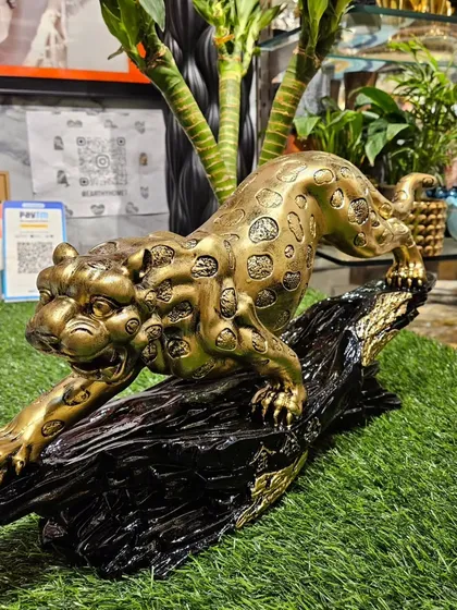 A still shot of the impressive golden jaguar, showcasing its dynamic pose and premium finish.