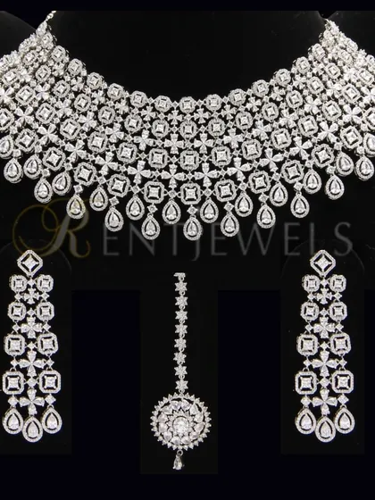 Experience the ultimate in bridal glamour with my exquisite collection of diamond-look sets. This handcrafted piece is designed to give you the sparkle and brilliance you deserve.