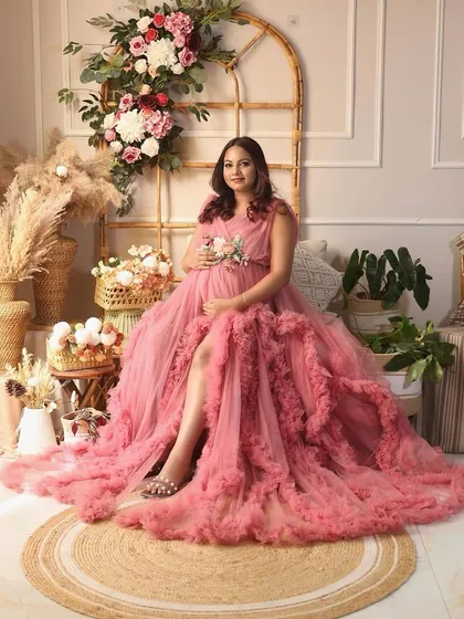 Another angle of the stunning pink gown, showing off its incredible volume and texture. A true fairytale dress.