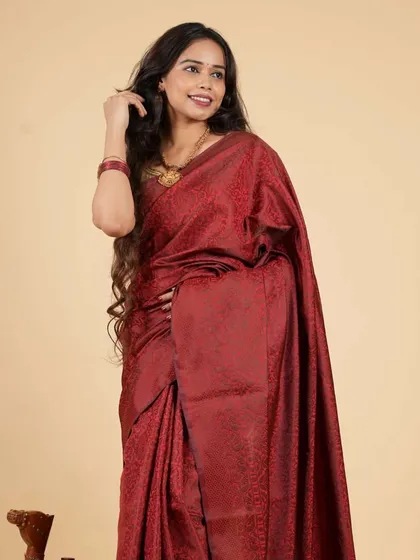 A deep maroon ready-to-wear saree with a subtle, self-woven pattern. This piece is ideal for formal events, offering a sophisticated and traditional look without any of the draping effort.
