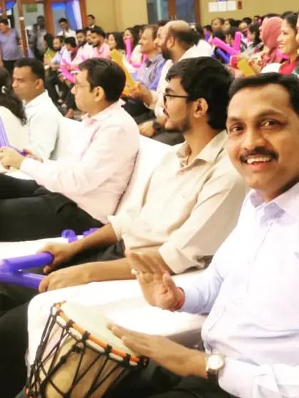 A candid shot from a Suryoday Bank anniversary event, where employees participated in a team-building drum circle. I focus on capturing genuine expressions of joy and engagement, delivering photos that feel authentic and full of life.