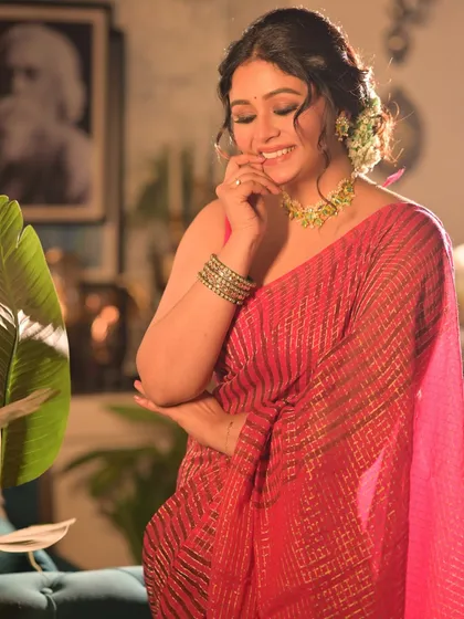 A candid shot of the model smiling, capturing a moment of genuine delight. This image feels spontaneous and adds a personal touch to the series.