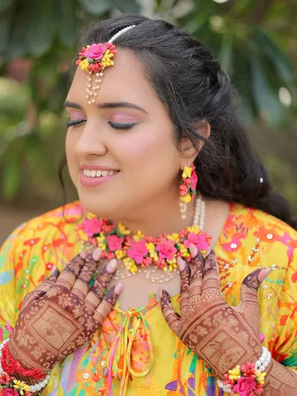 A serene moment. The pink eyeshadow adds a lovely pop of colour, and her skin looks absolutely radiant.