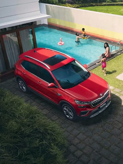 A stunning overhead shot from the Skoda Kushaq photoshoot, showing the car parked by a family enjoying their pool.
