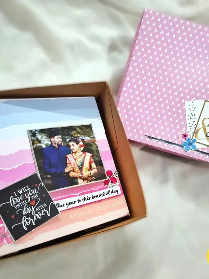 An anniversary scrapbook album shown with its matching custom-designed gift box.