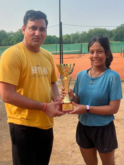 Eshanya Khattar, winner of the U18 Girls' title, proudly holds her trophy. This is one of many outstanding performances by our players at recent UTR tournaments.