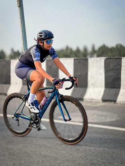 A female rider, focused and determined, during the race.