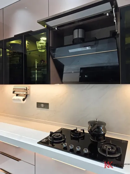 A look at the bi-fold lift-up shutter concealing the chimney pipe. This is how we create a clean, seamless look while maintaining full functionality of your appliances.