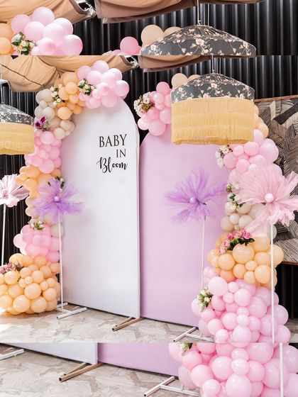 A glimpse of the beautiful "Baby in Bloom" decor. The elegant balloon arches in pastel colors set a festive and celebratory mood for the baby shower.