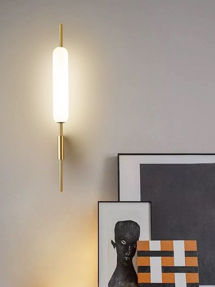 A simple and elegant linear wall sconce. The frosted tube provides a soft, even light, perfect for creating a calm atmosphere.