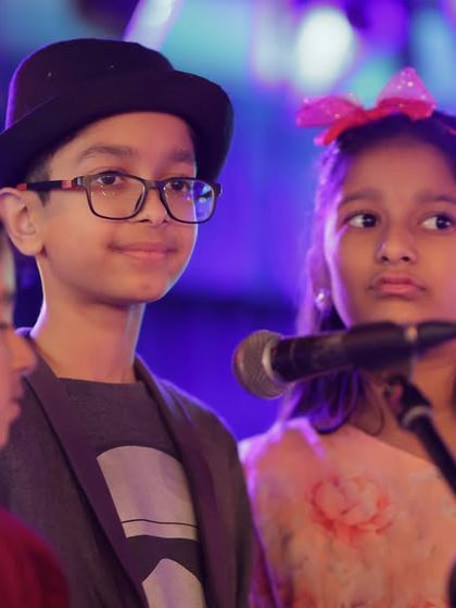 Some of our youngest performers getting ready to sing their hearts out. It's amazing to see them support each other on stage.