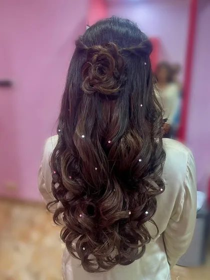 The back of the hair, highlighting the intricate hair rose and the scattered pearls on the waves.