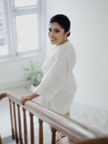 A simple, elegant look in white. This demonstrates my ability to present a clean, classic, and professional image suitable for daytime corporate functions or formal ceremonies.