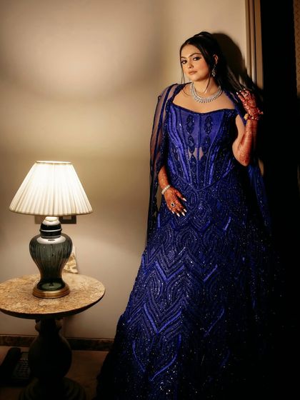 My client looking radiant and happy in the active blue embellished corset lehenga.